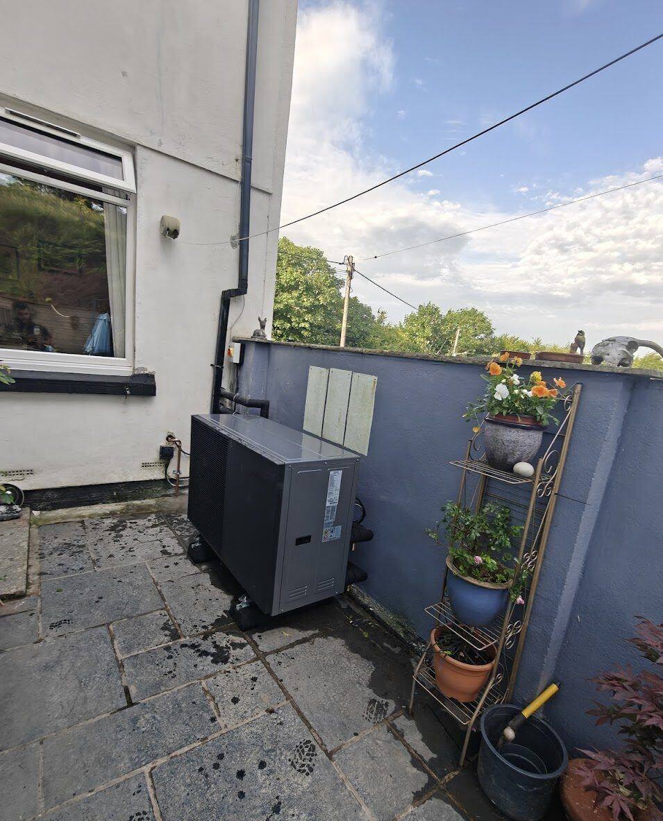 Heat pump heating system installed at a terraced property by BECS